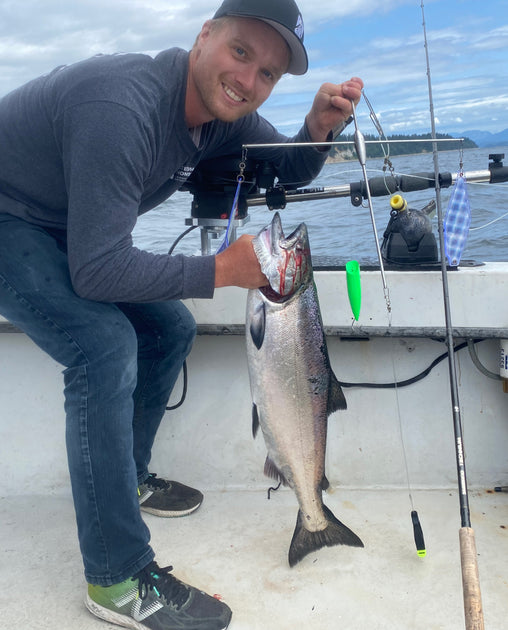 Glenn's son happily showing off the fish he just caught using the CruciFish.